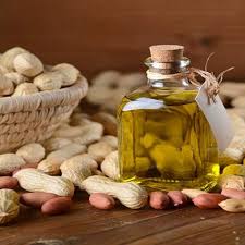 Bottle of Groundnut Oil with peanuts